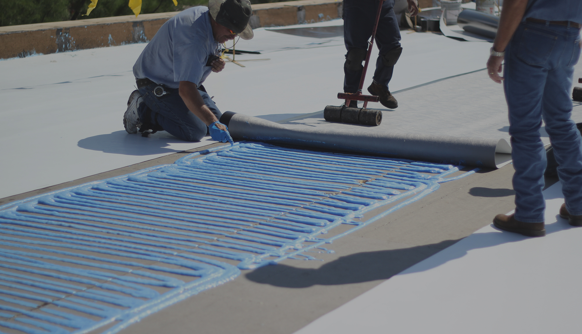 roof sealant being applied