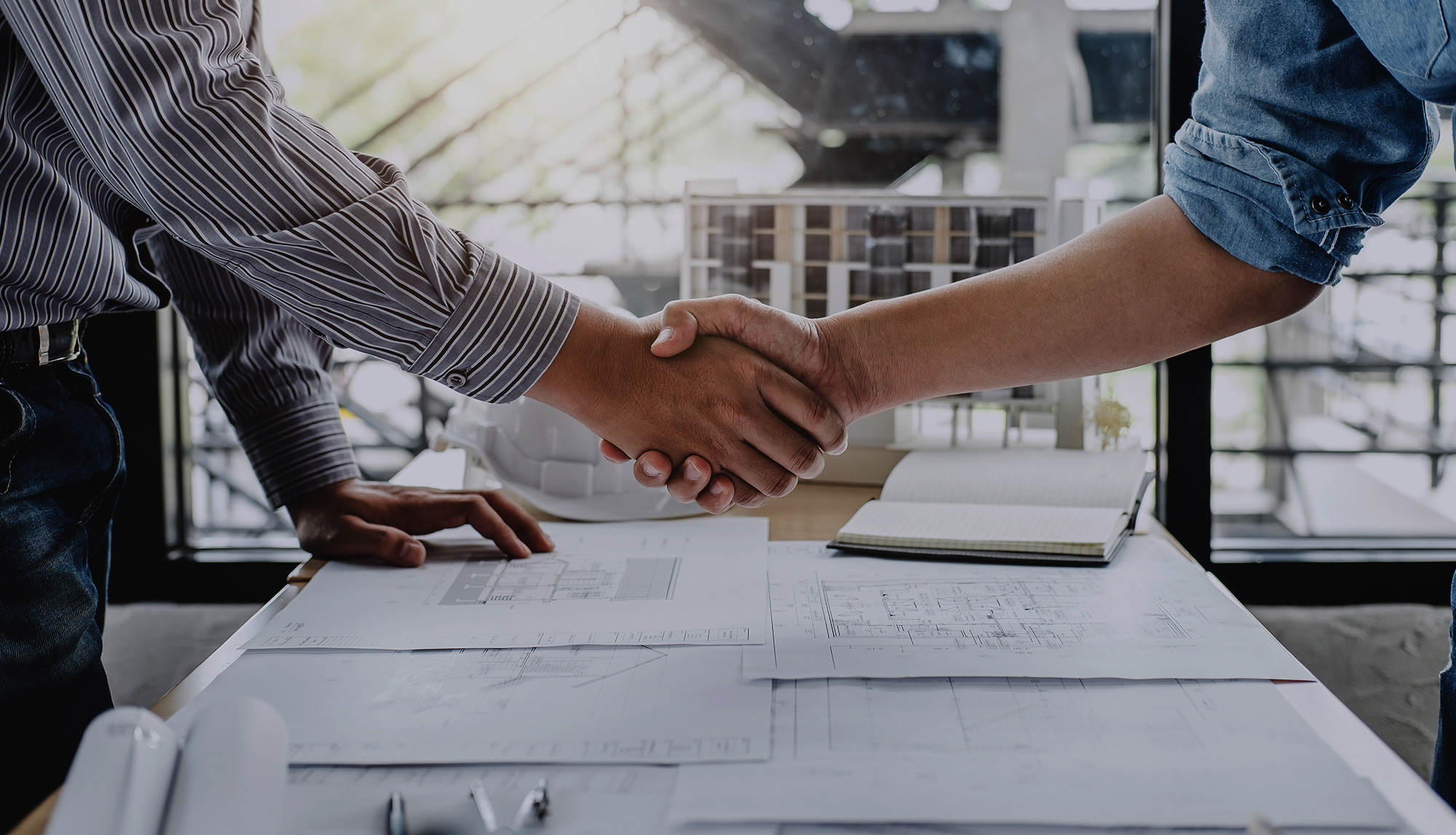 two contractors shaking hands